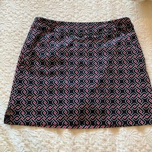 Great black red and red skort with button epaulette detail at waistband.